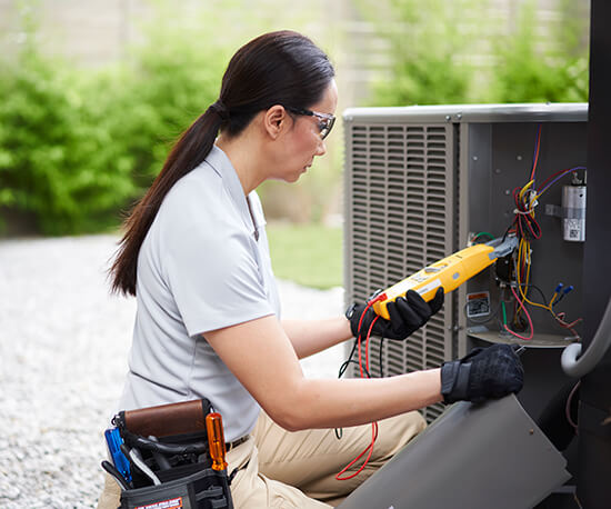 Technician working on air conditioner